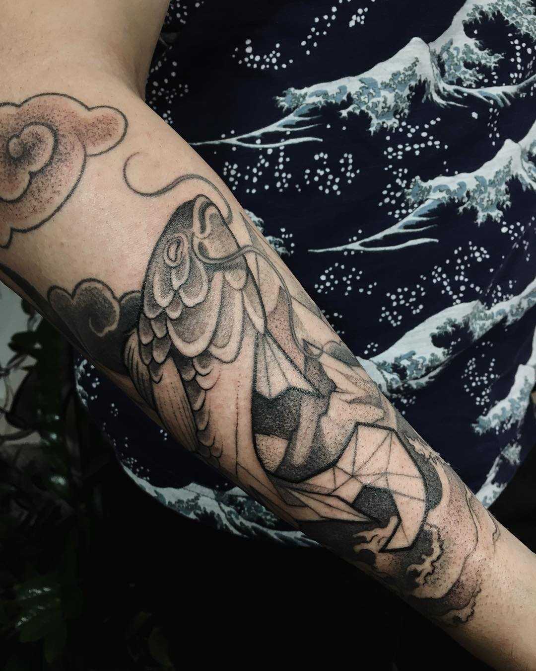 Fish tattoo by Sasha Tattooing