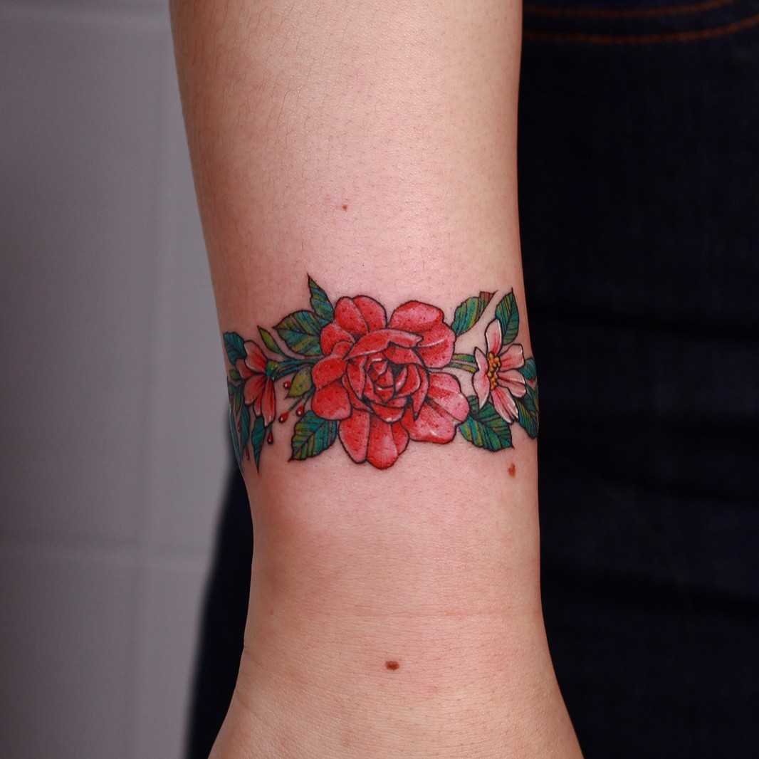 Floral bracelet done at High Tension Tattoo 