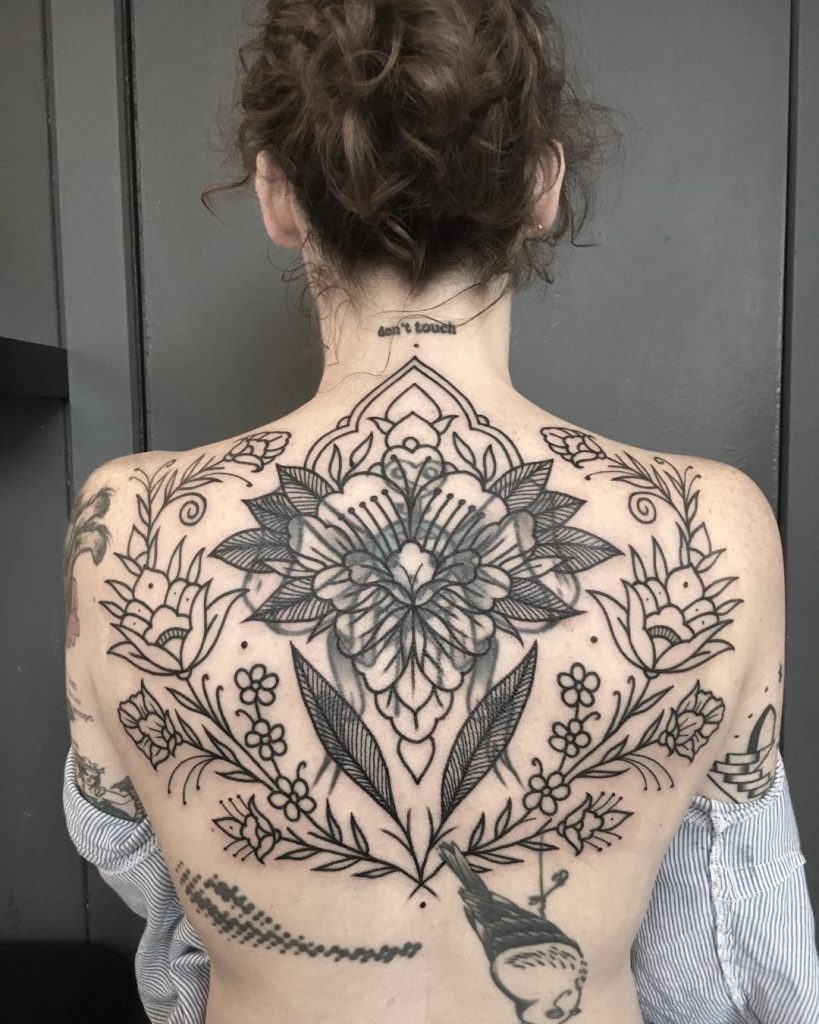 Floral ornaments all over the back - Tattoogrid.net