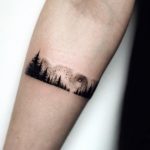 Forest armband tattoo on the forearm
