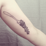Fork with spaghetti tattoo