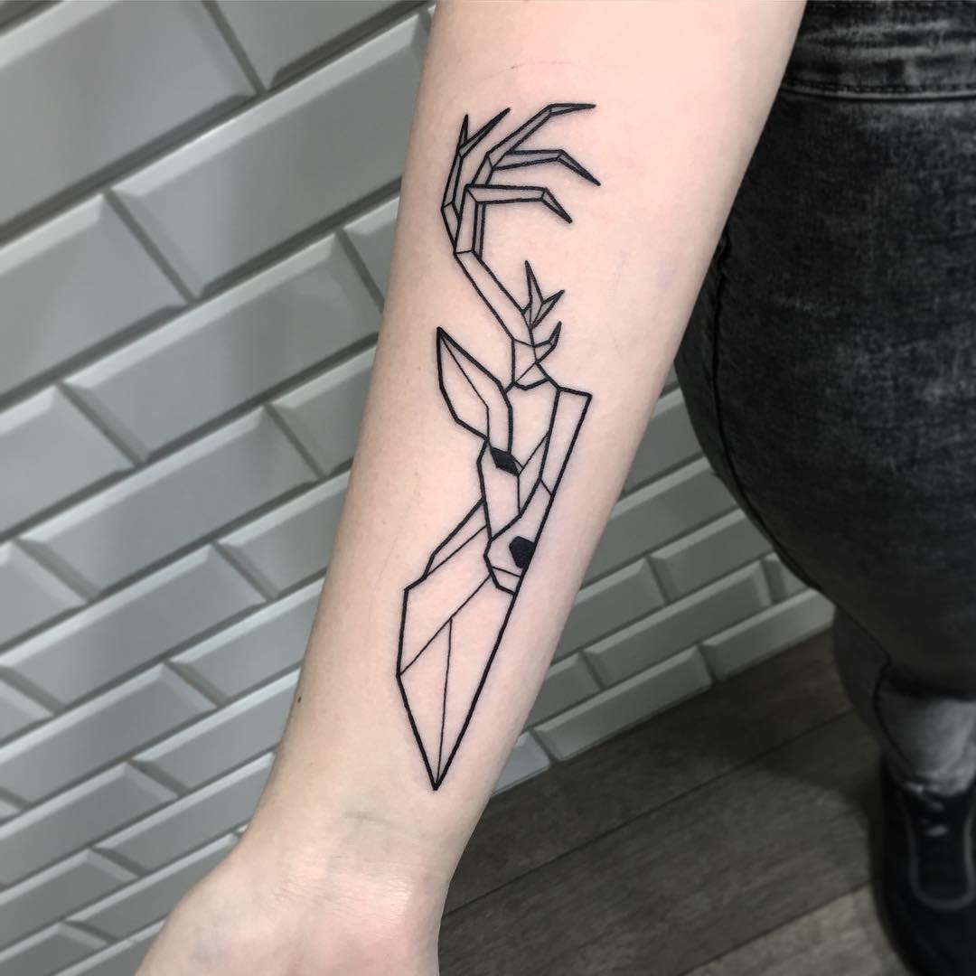 Geometric deer tattoo on the forearm