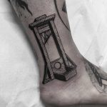 Guillotine tattoo done at Primordial Pain Tattoo