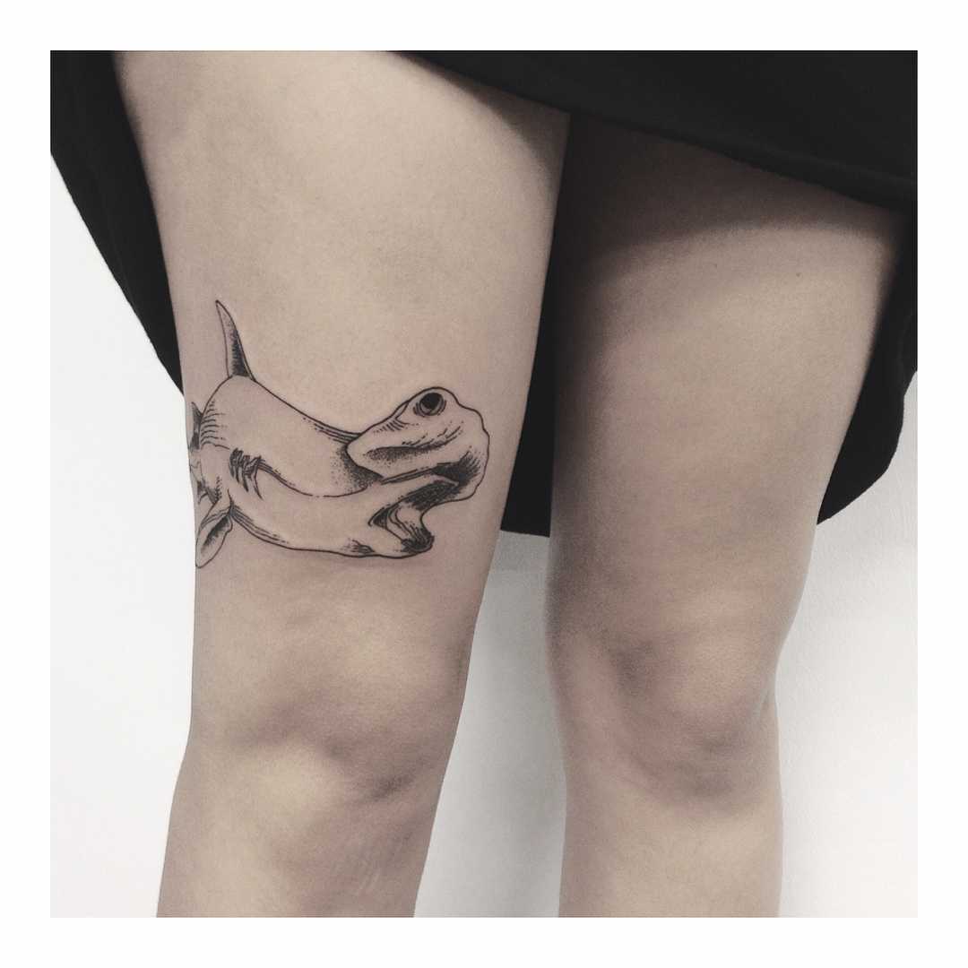 Hammerhead shark tattoo on the thigh