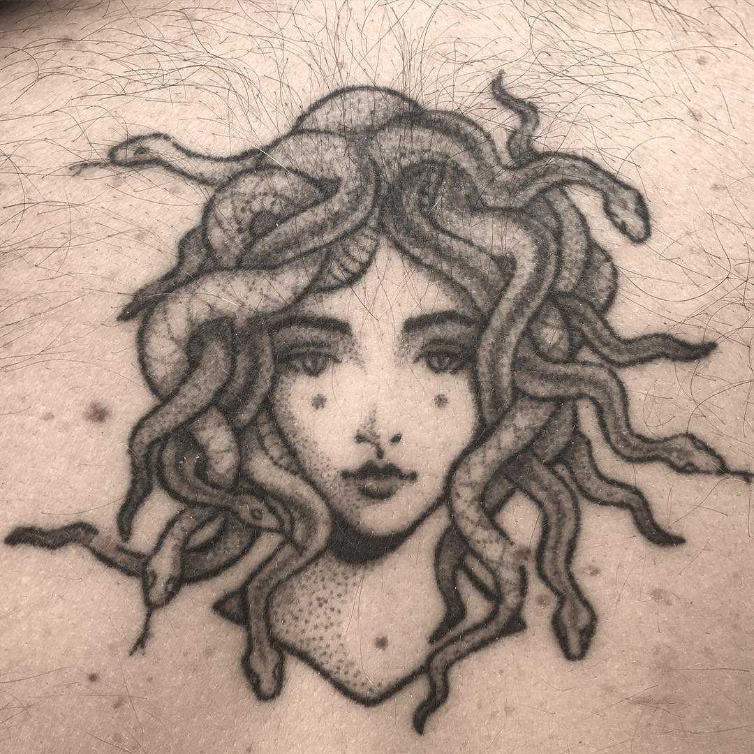 Hand-poked Medusa tattoo