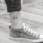 Hand-poked avocado tattoo on the ankle