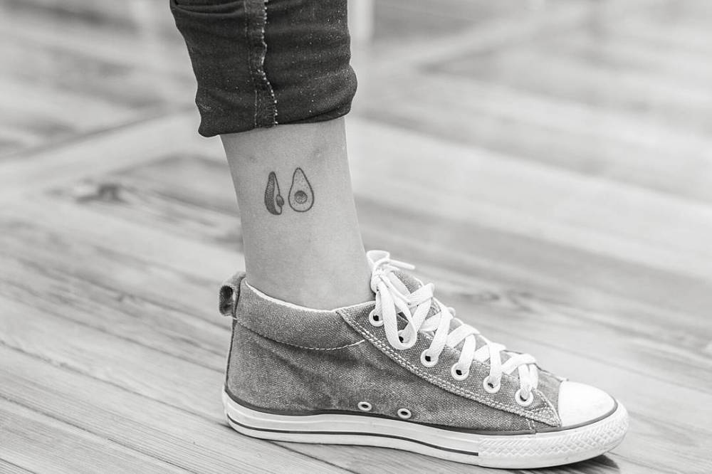 Hand-poked avocado tattoo on the ankle