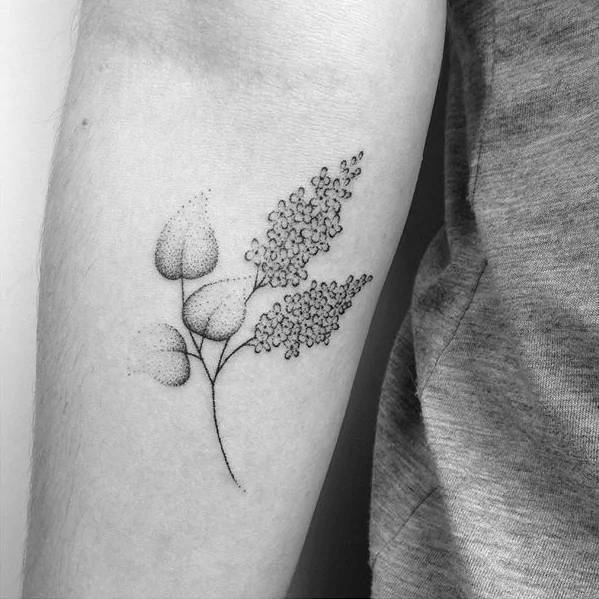 Hand-poked lilac tattoo