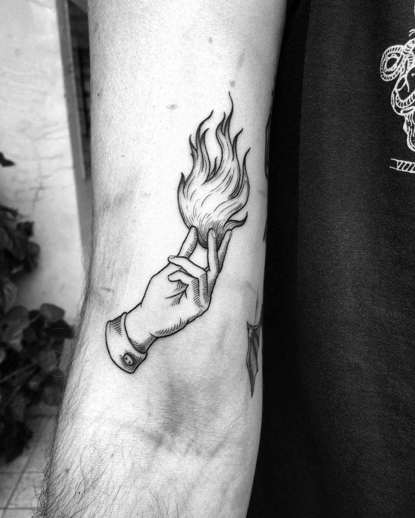 Hand with a fire tattoo