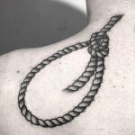 Hangman's knot tattoo on the shoulder
