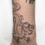 Happy dragon by Femme Fatale Tattoo
