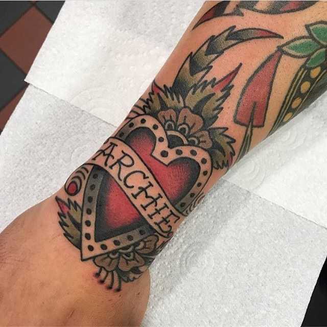 Heart tattoo by Bailey Tattooer