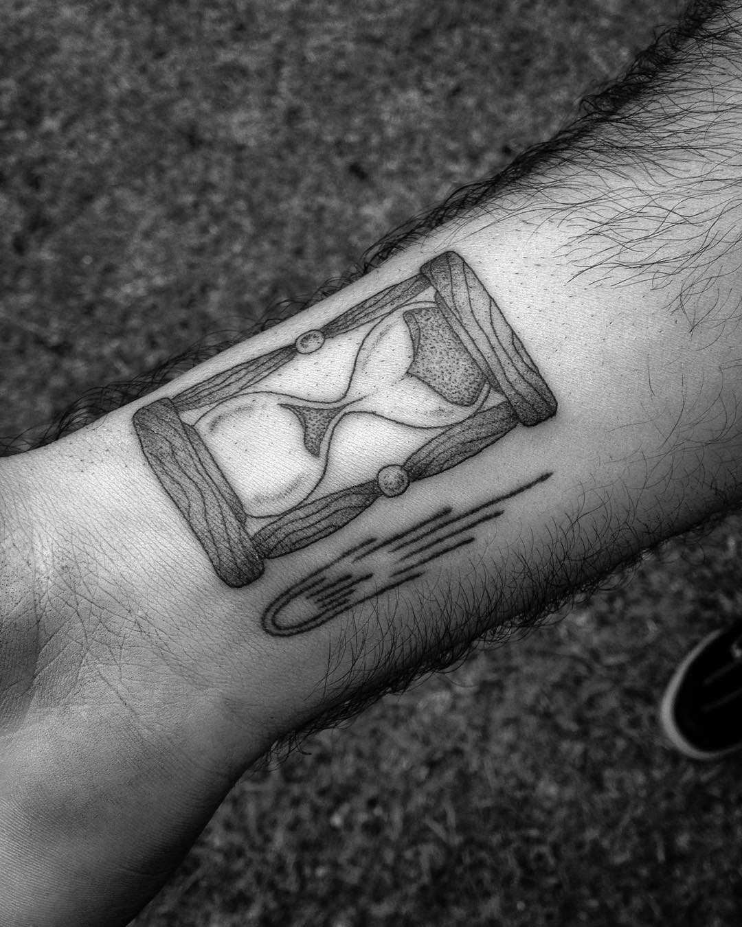 Hourglass and comet tattoo
