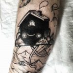 House with legs tattoo