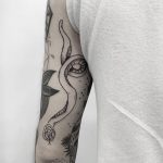 Imperfect snake tattoo