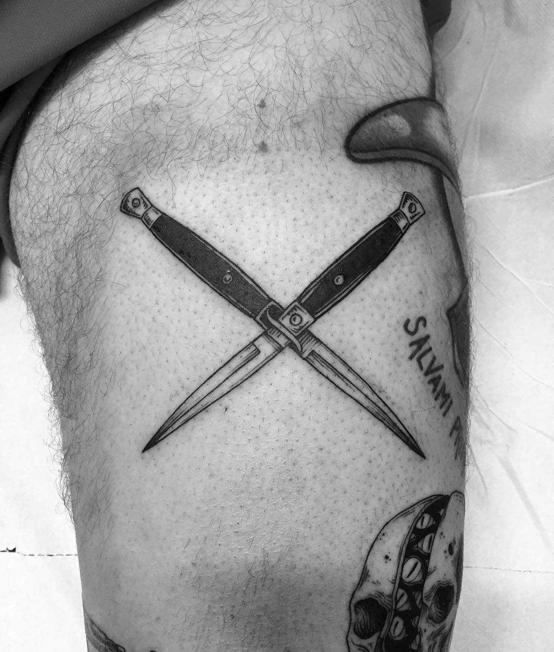 Knives tattoo done at Primordial Pain Tattoo, Milano