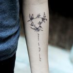 Leafed branches and script tattoo by Helen Xu