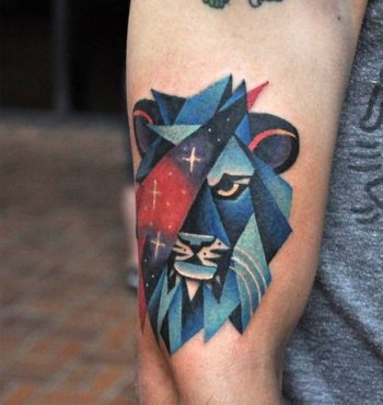 Lion head and cosmic triangle tattoo