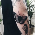 Little butterfly tattoo on the elbow
