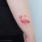 Little flamingo and sun tattoo