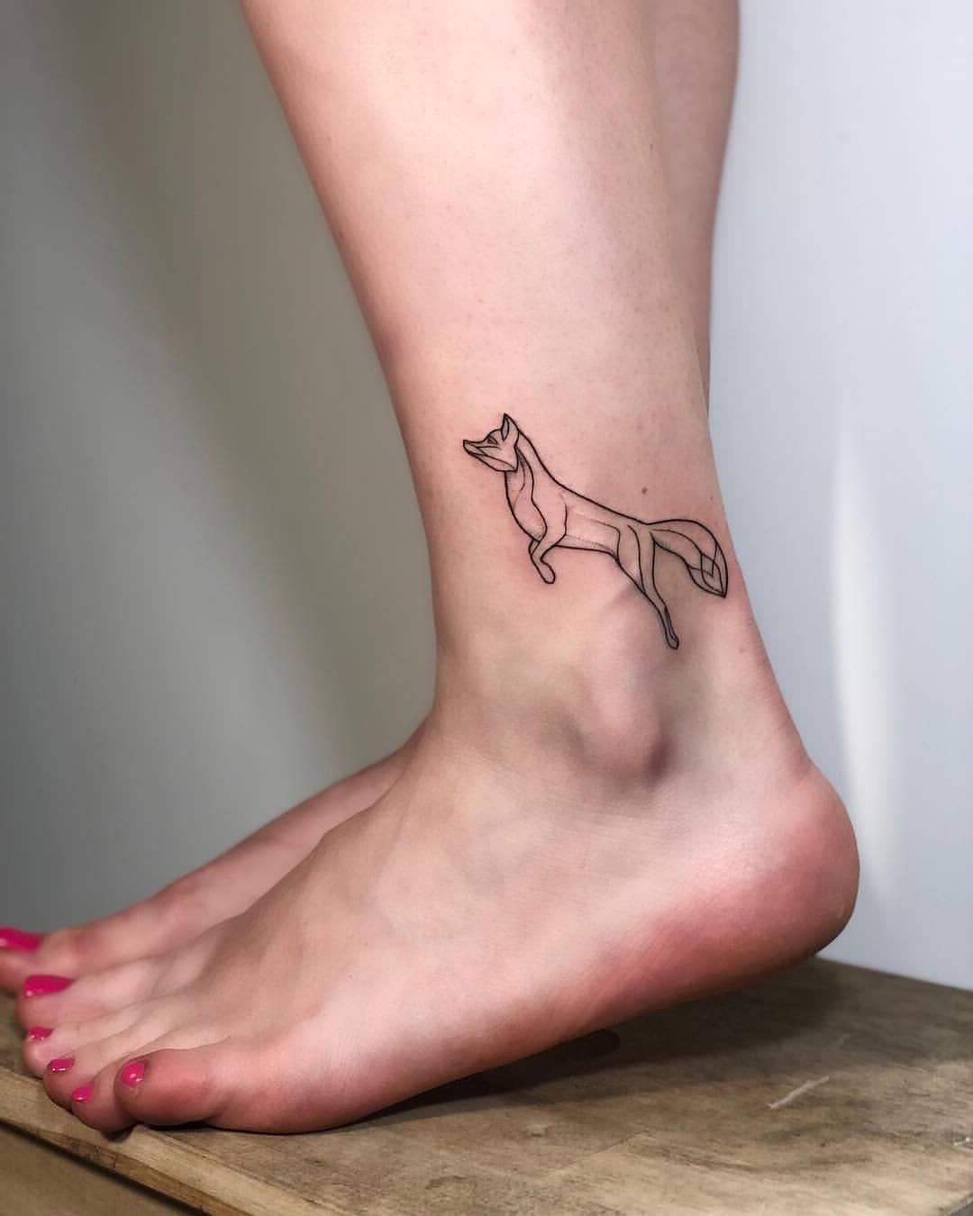 Little fox tattoo on the ankle