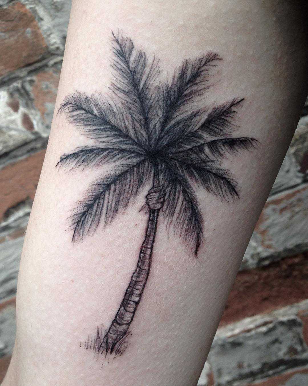 Little palm tree tattoo on the inner arm