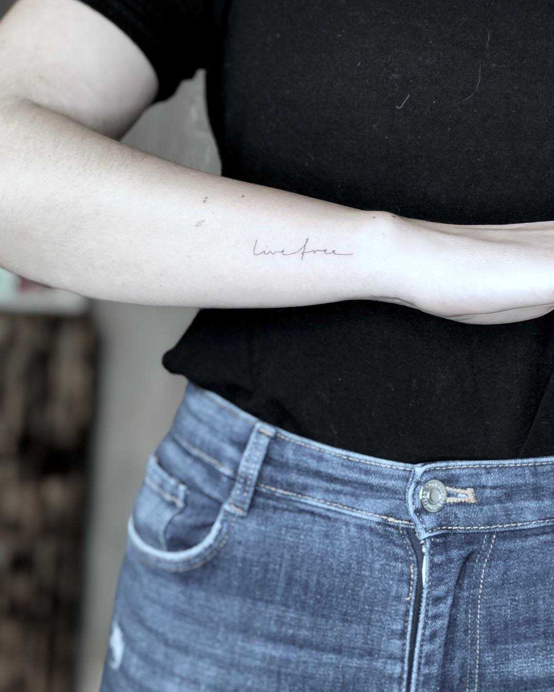 Live free single needle lettering tattoo