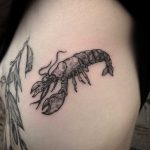 Lobster tattoo on the rib