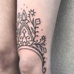 Lovely ornament tattoo on the left thigh