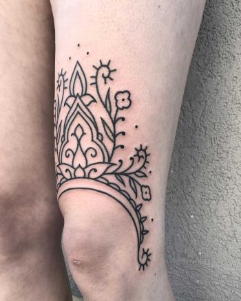 Lovely ornament tattoo on the left thigh