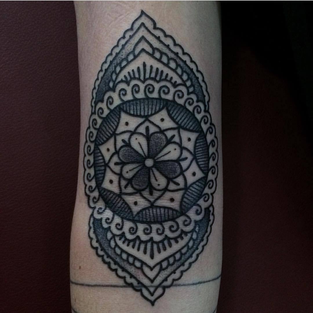 Mandala and ornamental pattern tattoo