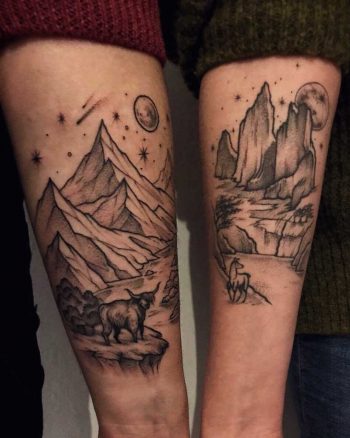 Matching landscape tattoos on forearms