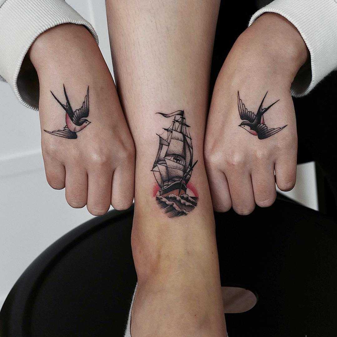Matching swallows and a ship tattoo