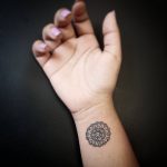 Mini mandala tattoo on the wrist