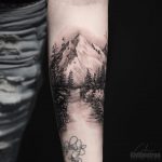Mountainous landscape tattoo by Calvin Grxsy