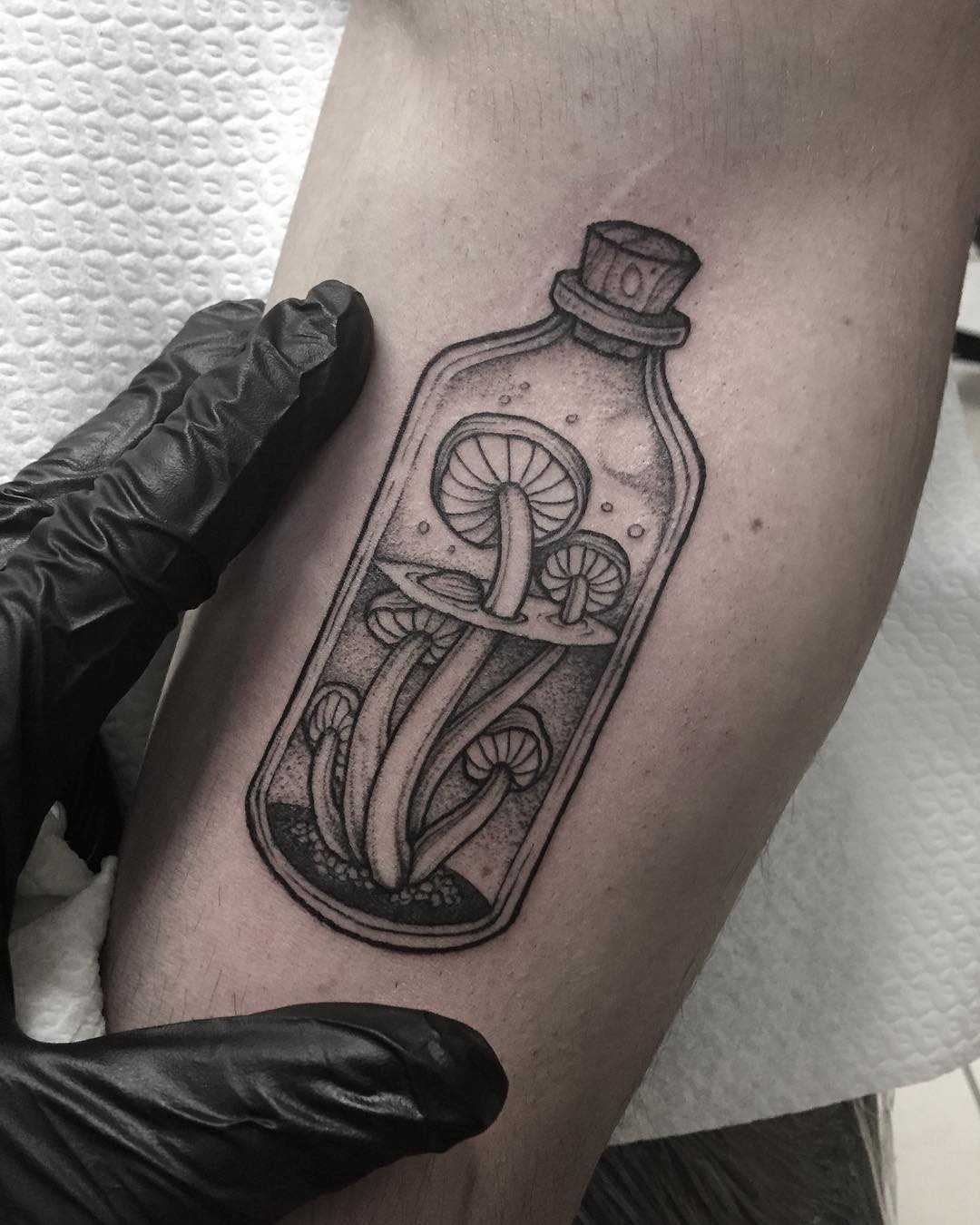 Mushrooms in a bottle done at Primordial Pain Tattoo