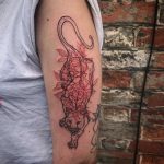 Panther and red botanicals tattoo