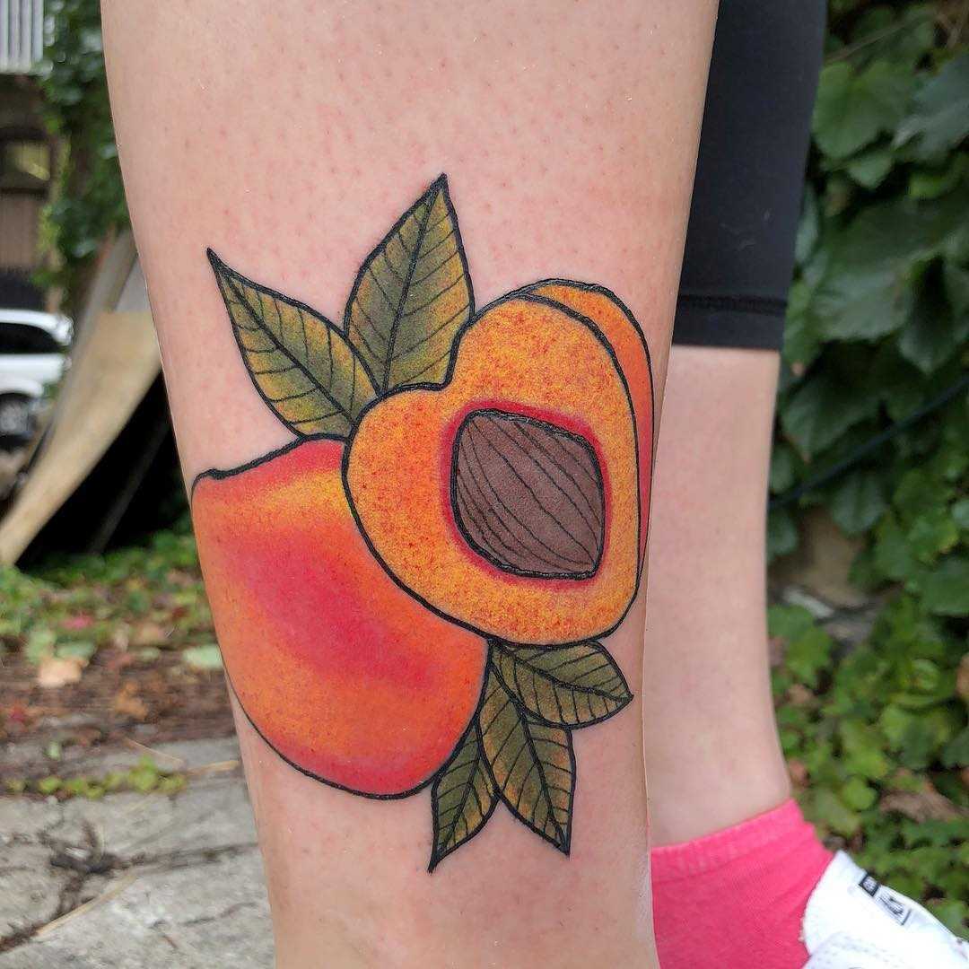Peach tattoo on the right shin