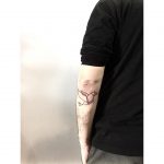 Polygonal bird tattoo on the arm