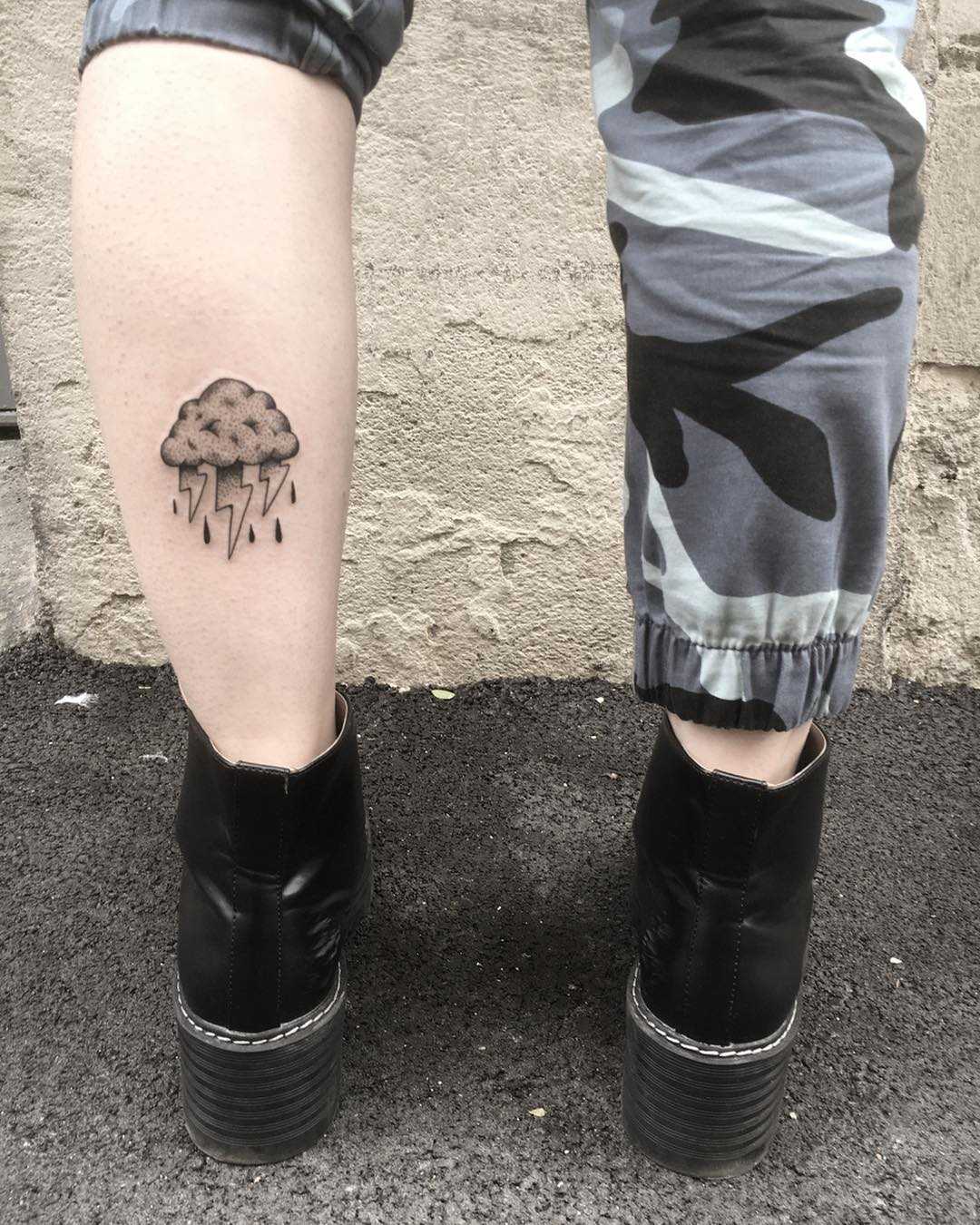 Rain cloud tattoo on the calf