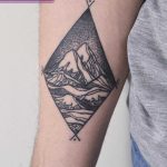 Rhombus-shaped mountain landscape tattoo
