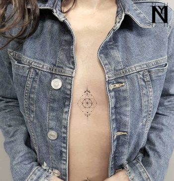 Seed of life tattoo on the sternum