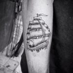 Simple ship tattoo on the right forearm