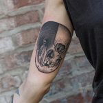 Skull and crow tattoo by Valentin Hirsch