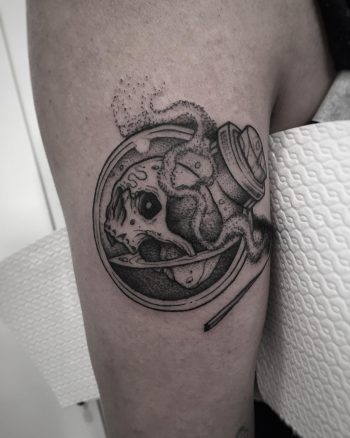 Skull in a bottle with a matchstick