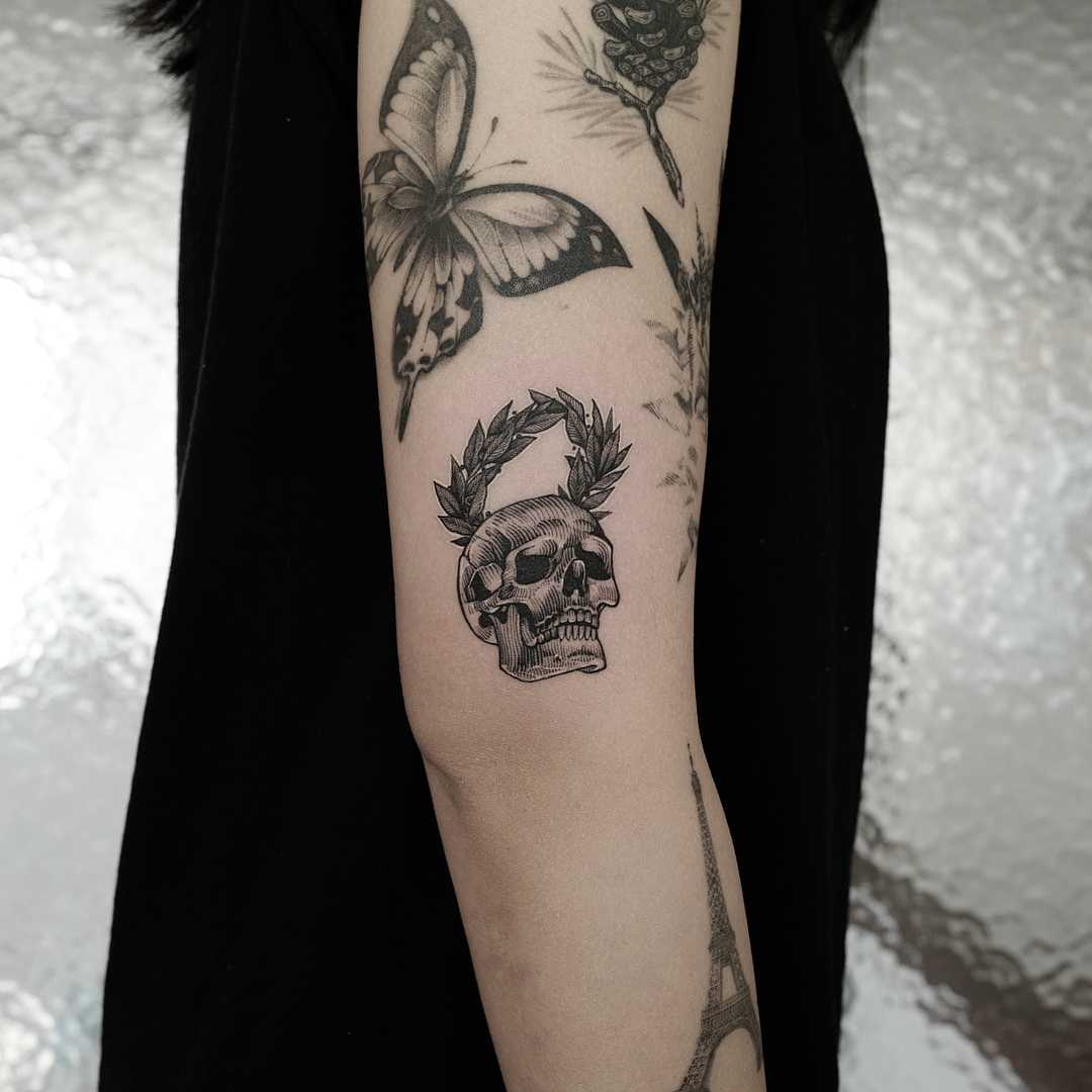 Skull with a laurel wreath tattoo