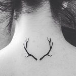 Small antlers tattoo on the back