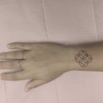 Small sacred geometry tattoo on the wrist