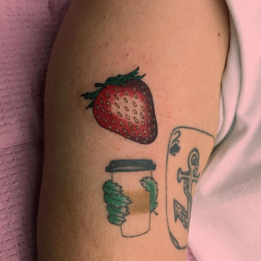 Small strawberry tattoo by Jen Wong