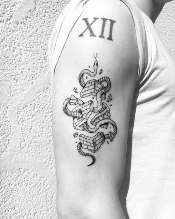 Snake and broken brick house tattoo
